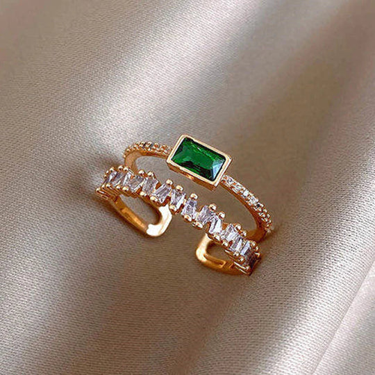 Lustrous Gold Ring with Emerald and Zirconia Details